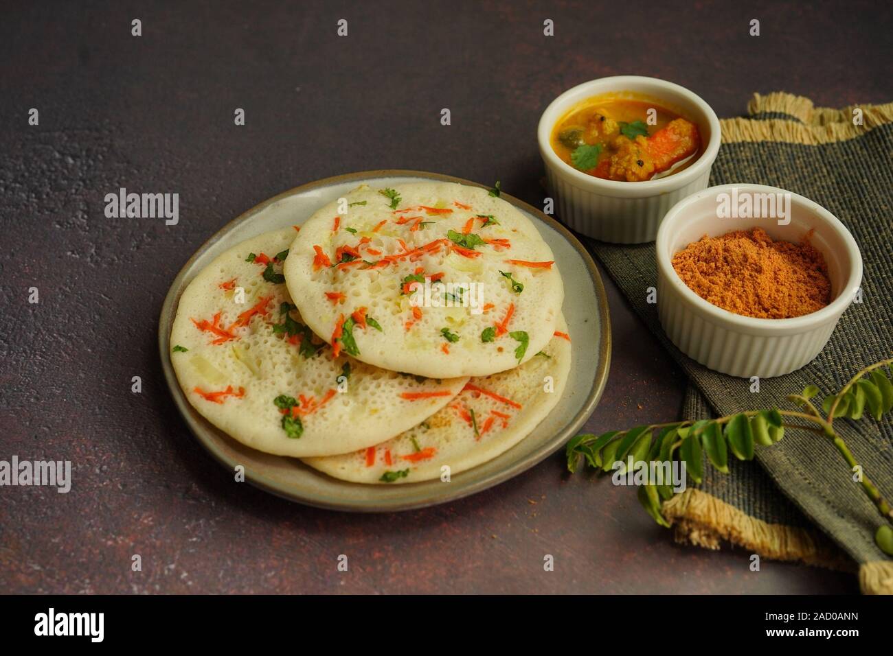 Uthappam/ Oothappam South Indian breakfast set dosa topped with onion carrots served with