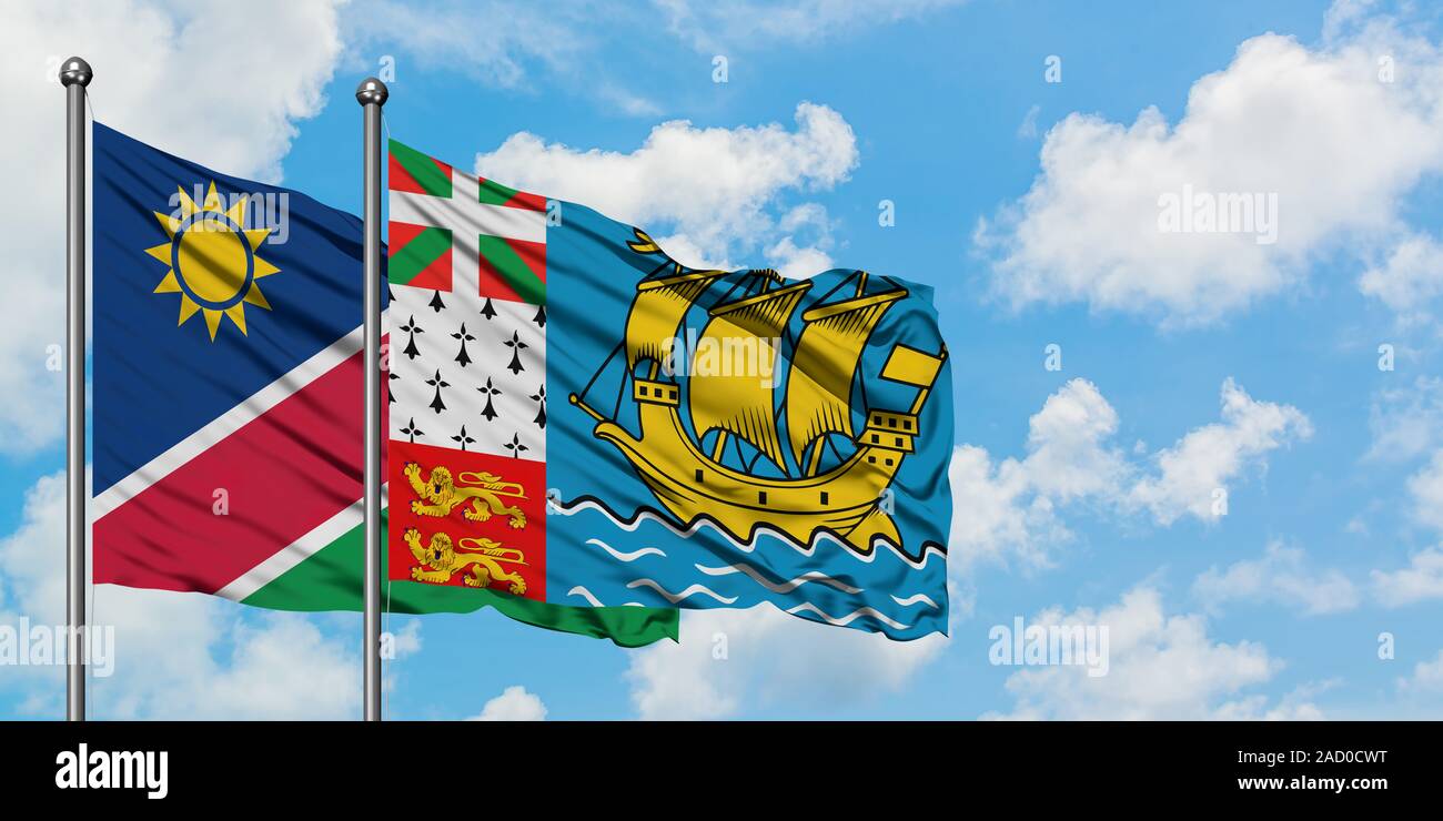 Namibia and Saint Pierre And Miquelon flag waving in the wind against ...