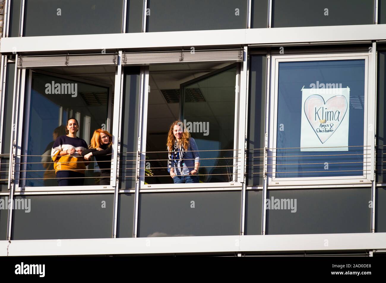 November 29, 2019 - Cologne, Germany. Spectators at  windows during Fridays for Future climate strike. 4th global day of action initiated by young peo Stock Photo