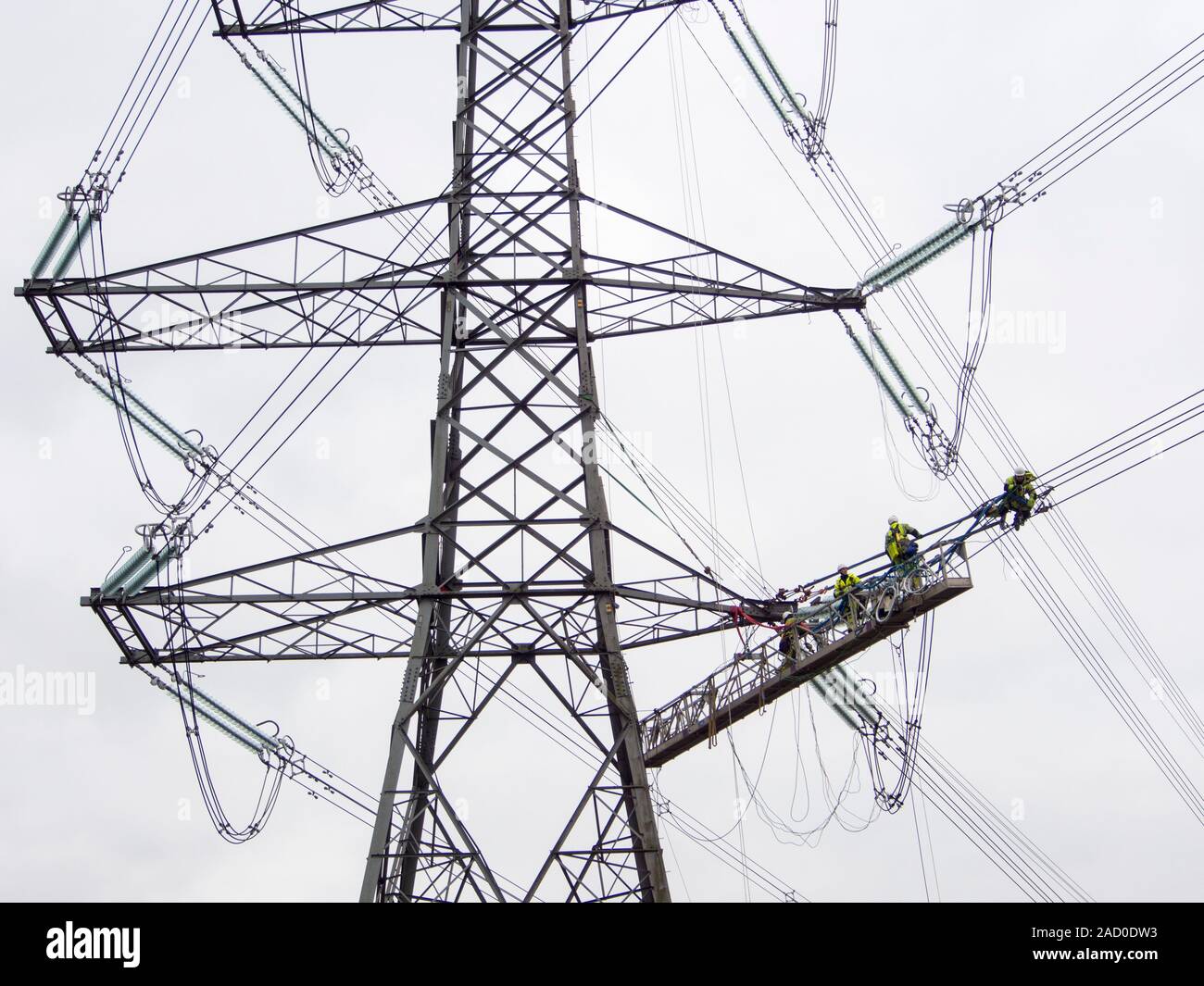 Pylons Inslulators Technicians working to replace old insulators on a pylon in Barrow on ...
