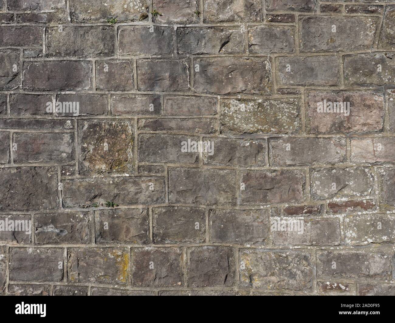 grey stone wall useful as a background Stock Photo - Alamy