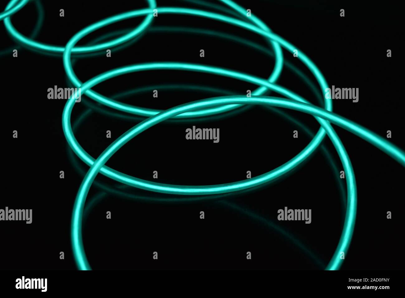 Unusual bright wires made of turquoisecolored material glowing at