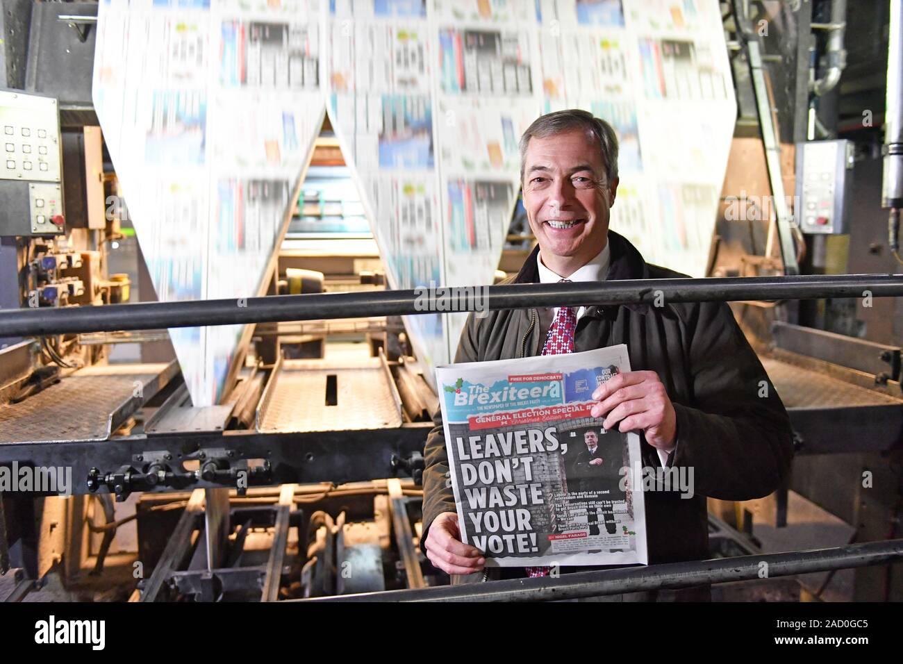 Brexit Party leader Nigel Farage holds up a copy of The Brexiteer during a visit to JPI Printers in Dinnington, South Yorkshire, whilst on the General Election campaign trail. Stock Photo