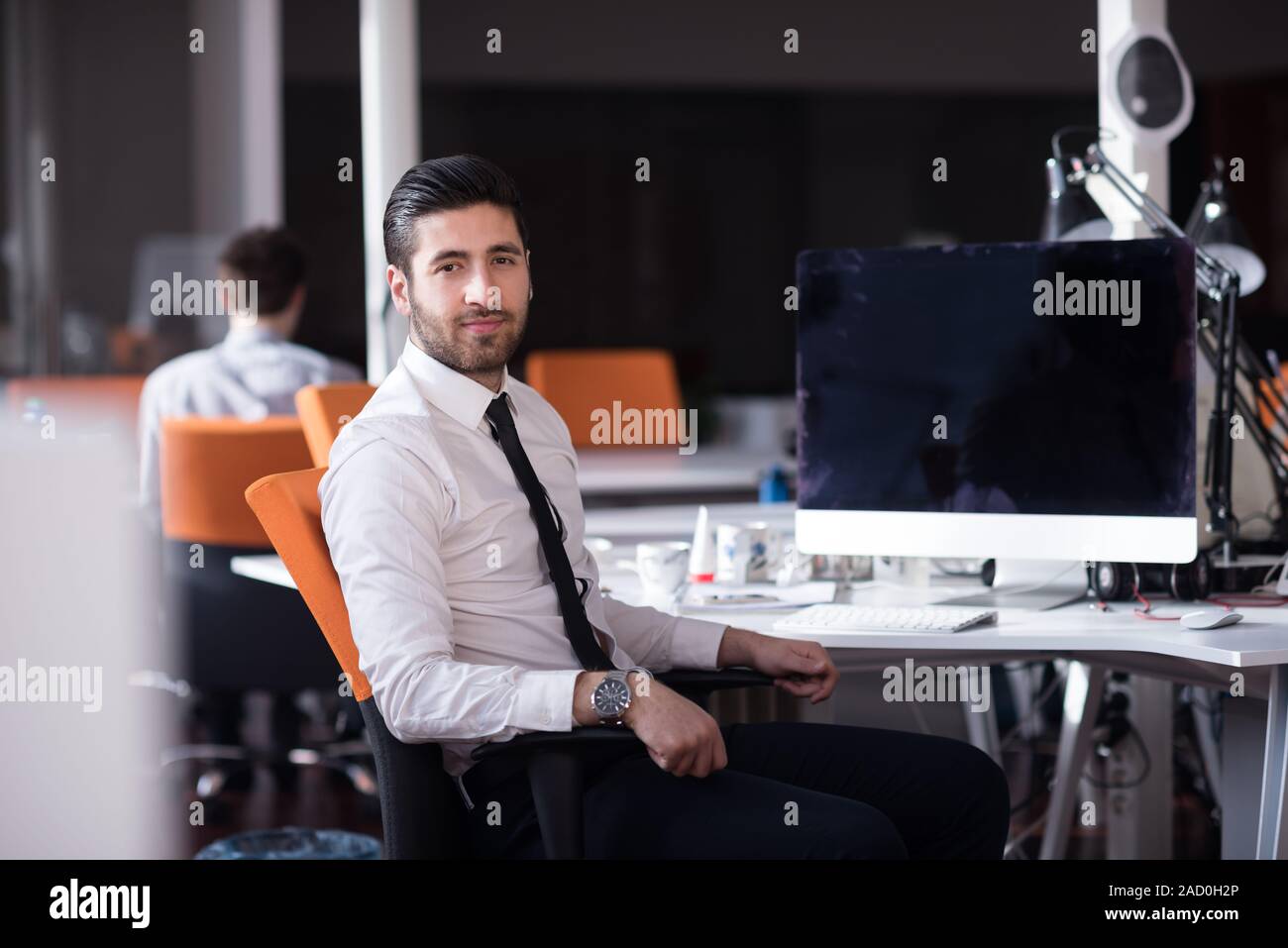 young Business man  working on desktop computer Stock Photo