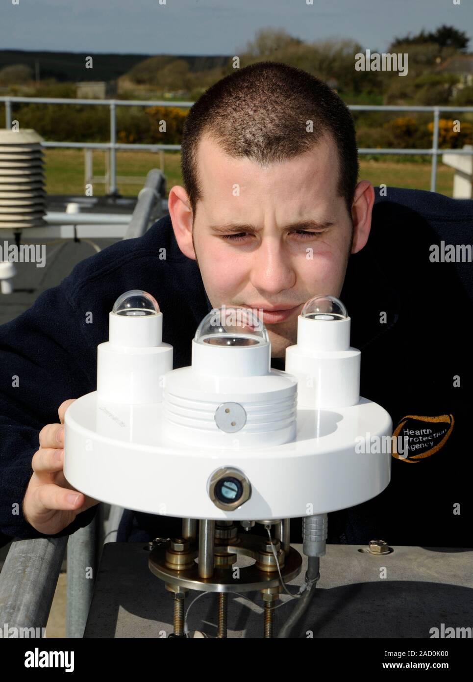 Solar radiation monitoring. Health Protection Agency worker examining
