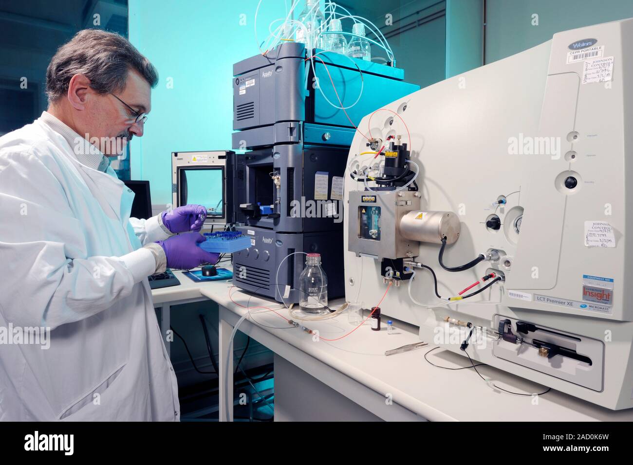 Liquid chromatography mass spectrometer. Technician preparing samples
