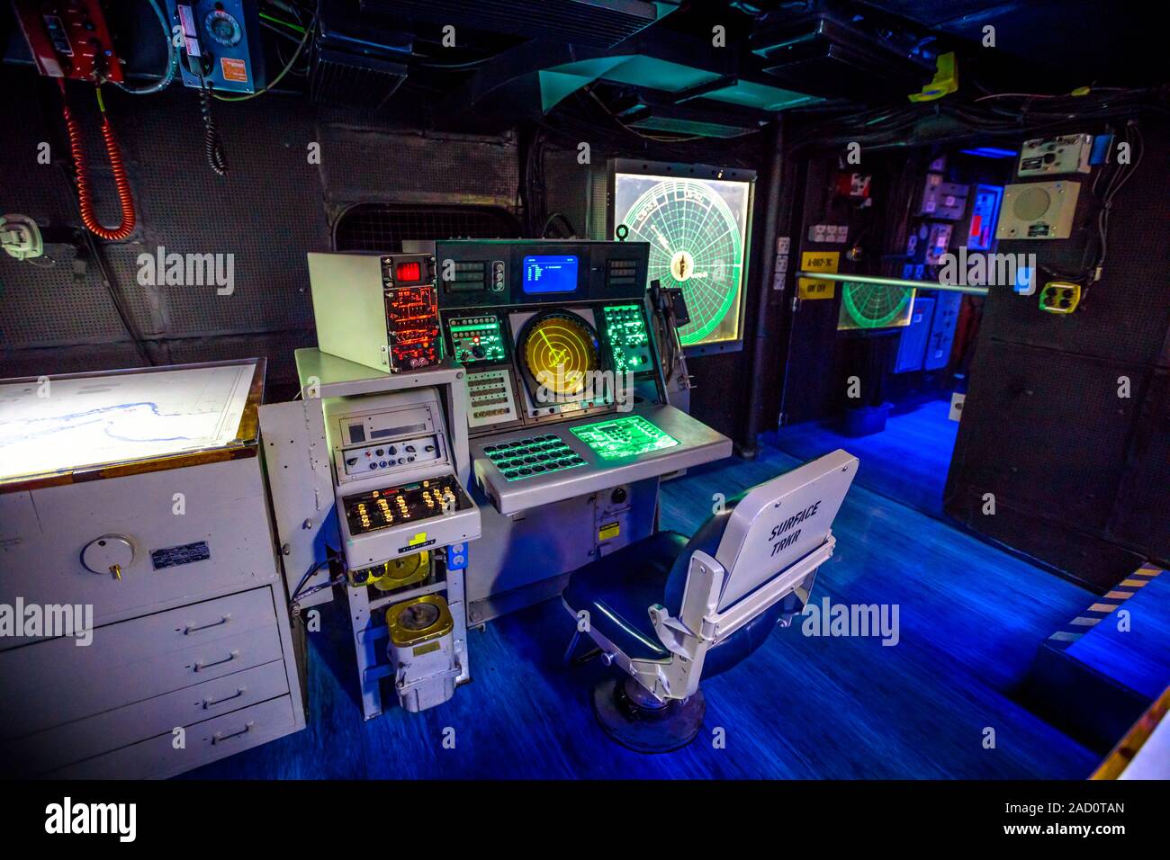 San Diego, Navy Pier, California, USA - JULY 31, 2018: operations room with lights on instruments, consoles, maps and radars of Battleship Midway at Stock Photo