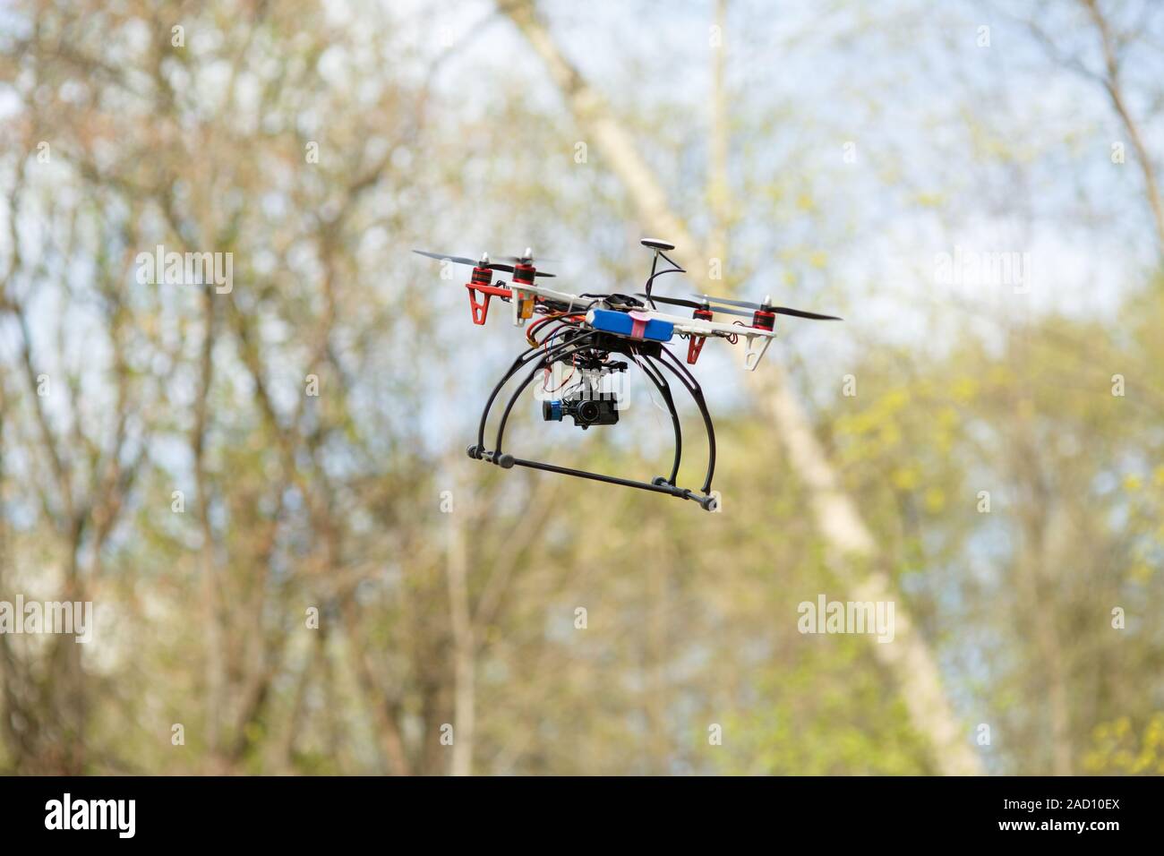 Drone flying in forest Stock Photo