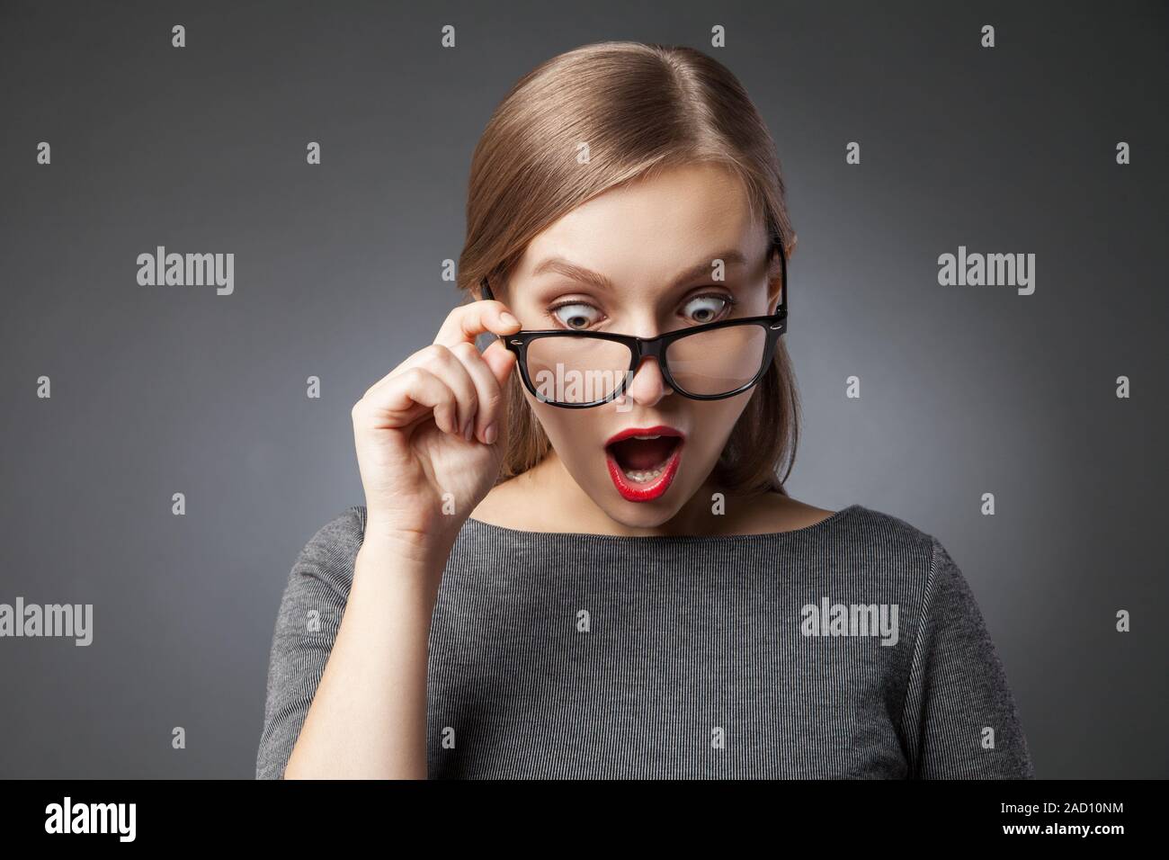 Woman wearing glasses looking down hires stock photography and images Alamy