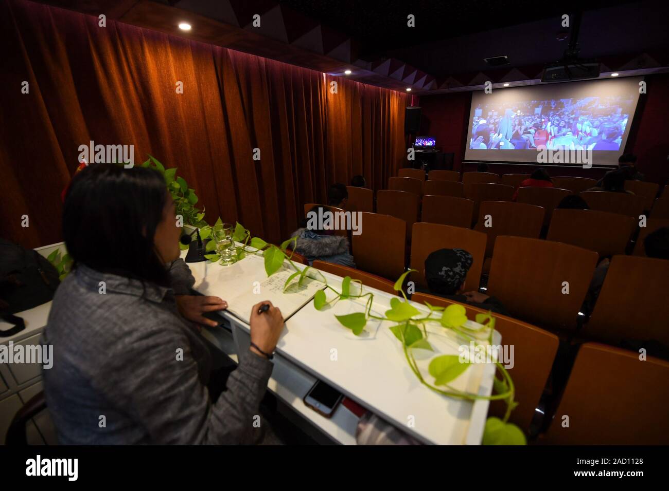Inner Mongolia, China. 03rd Dec, 2019. Surina describes for the visually impaired people as they