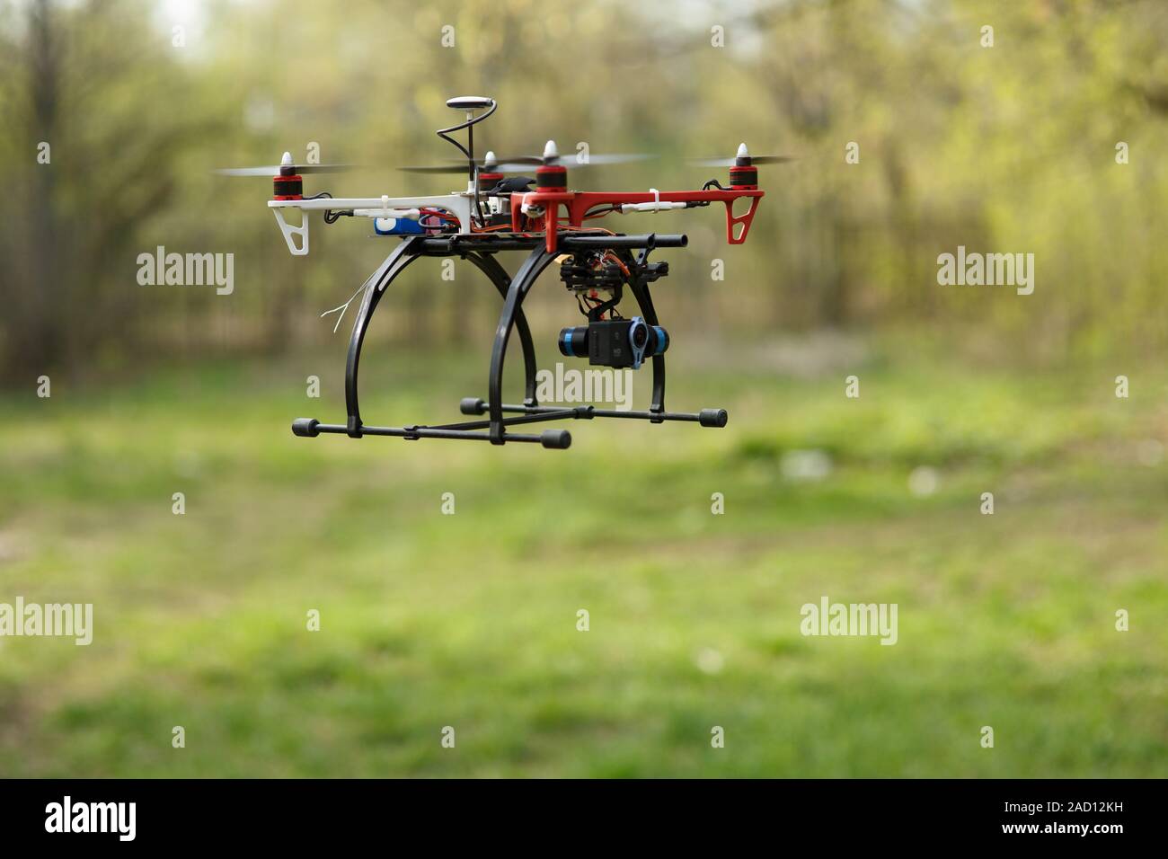 Drone flying in forest Stock Photo
