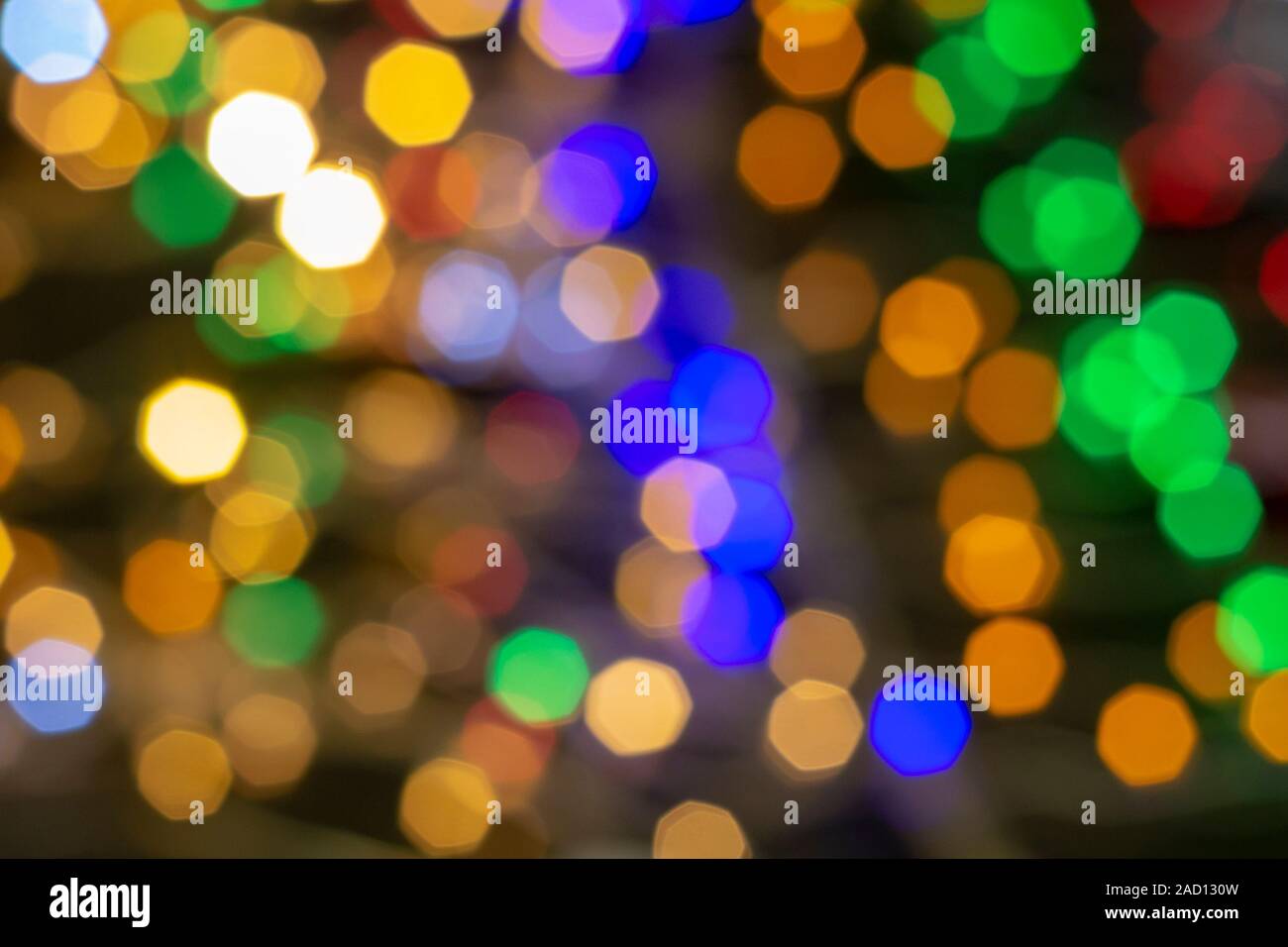 Hexagonal glare multicolor backdrop. Abstract textural background. Bokeh Stock Photo