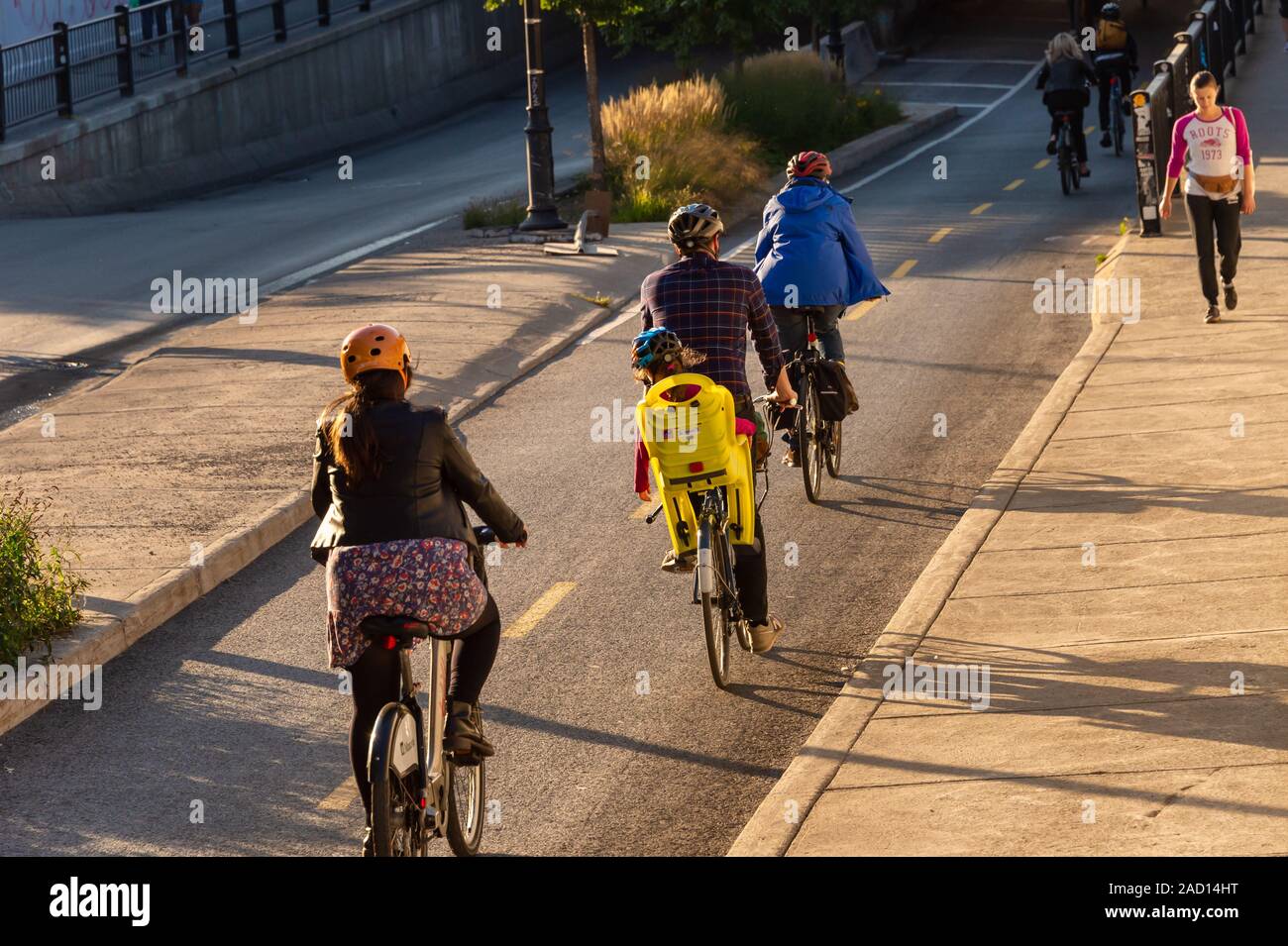 Montreal, Canada - 19 September 2019: People riding bikes on a cycle path, on Saint Laurent Boulevard. Stock Photo