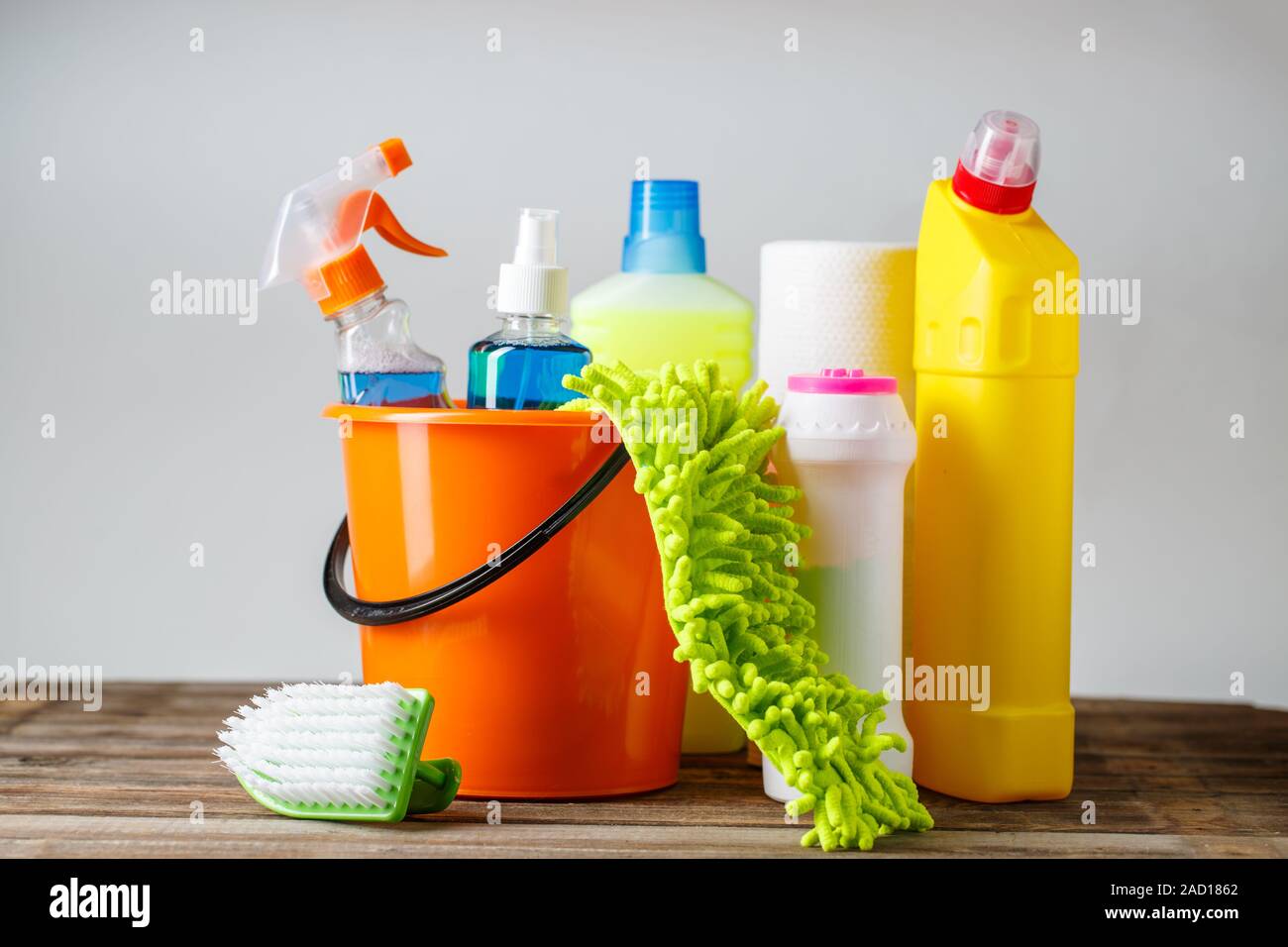 Bucket with cleaning items on light background Stock Photo