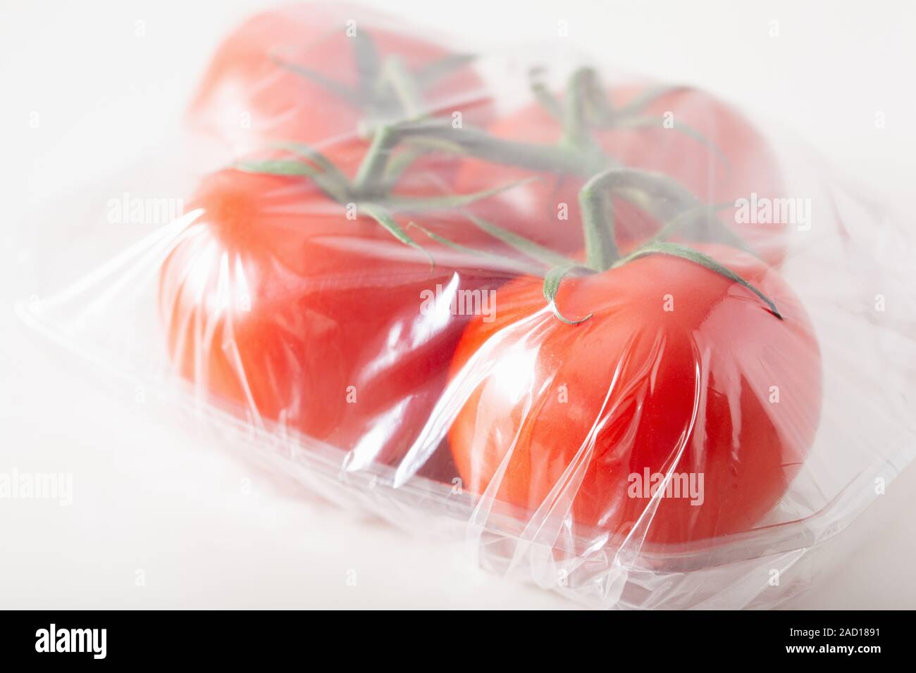 single use plastic packaging issue. tomatoes vegetables in plastic bag
