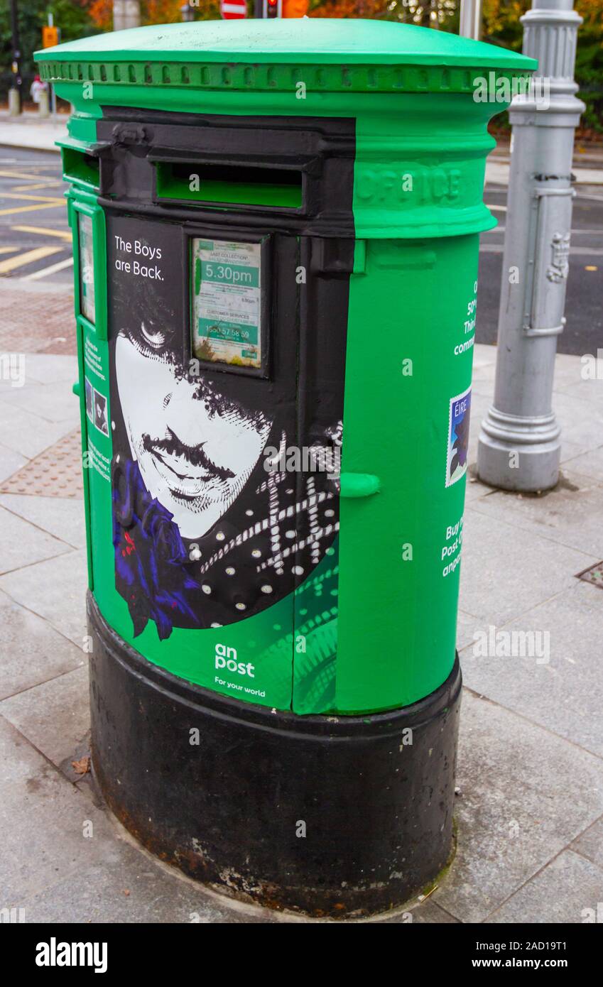 Thin Lizzy postage stamps to mark 50th anniversary of Irish rock band. Poster on green post box mailbox of Phil Lynott. Dublin, Ireland, Europe Stock Photo