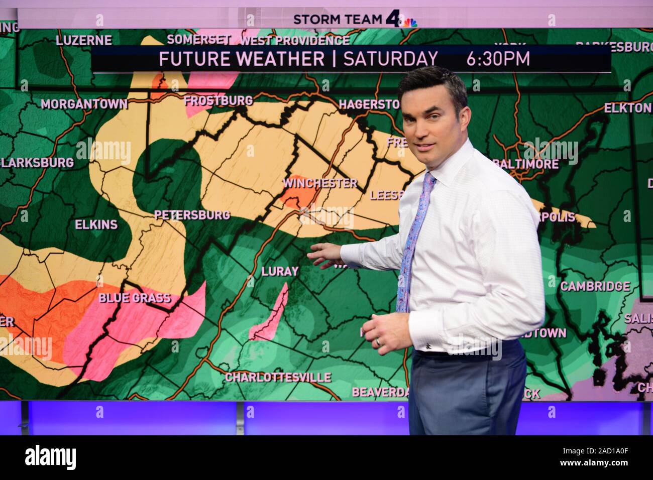 Meteorologist working on a weather forecast prediction for a Washington DC television station Stock Photo
