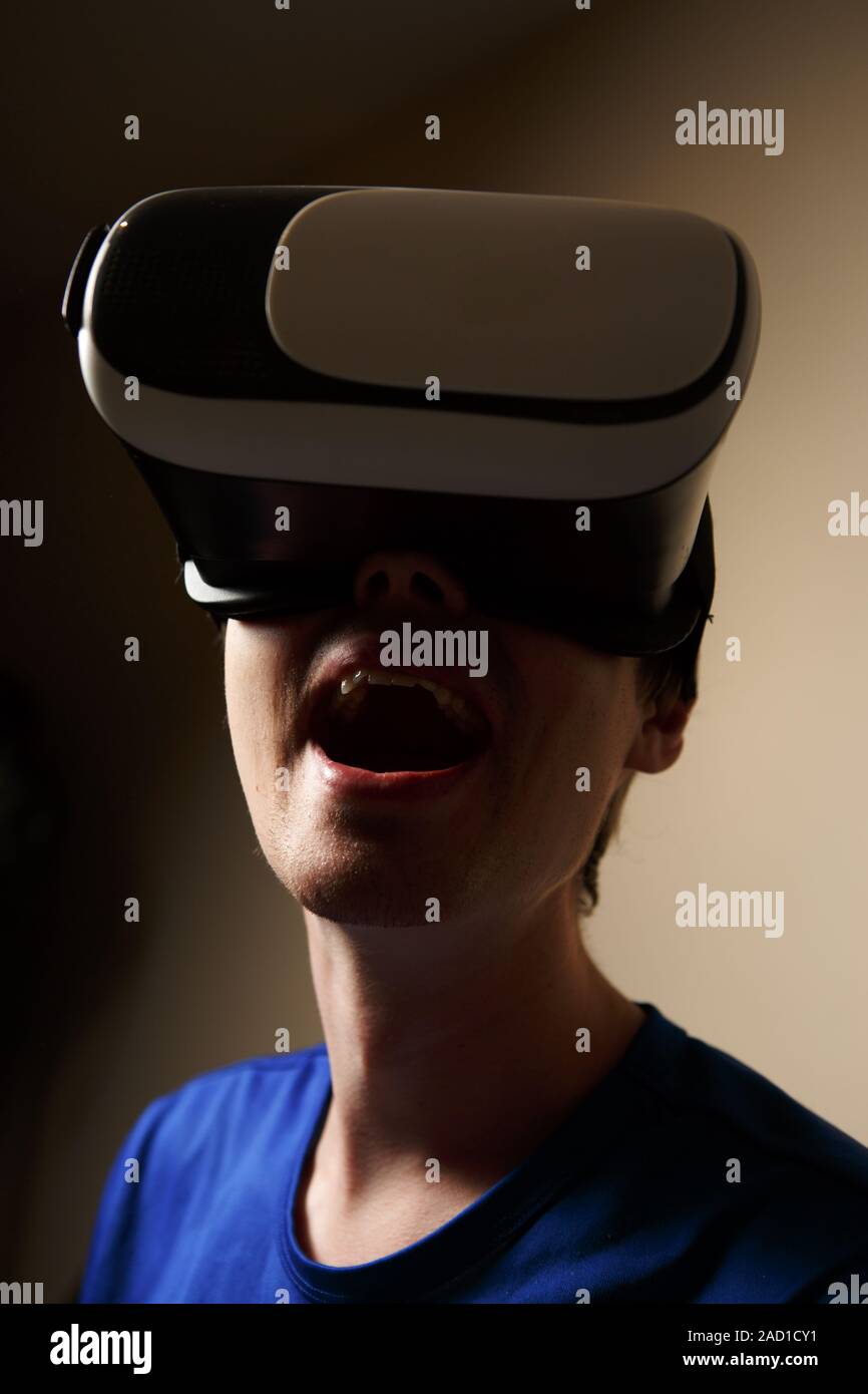 Man wearing virtual reality goggles Stock Photo - Alamy