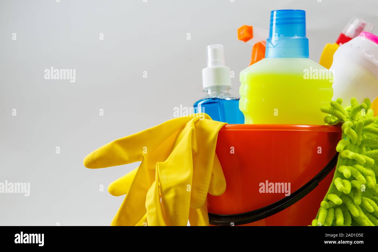 Bucket with cleaning items on light background Stock Photo