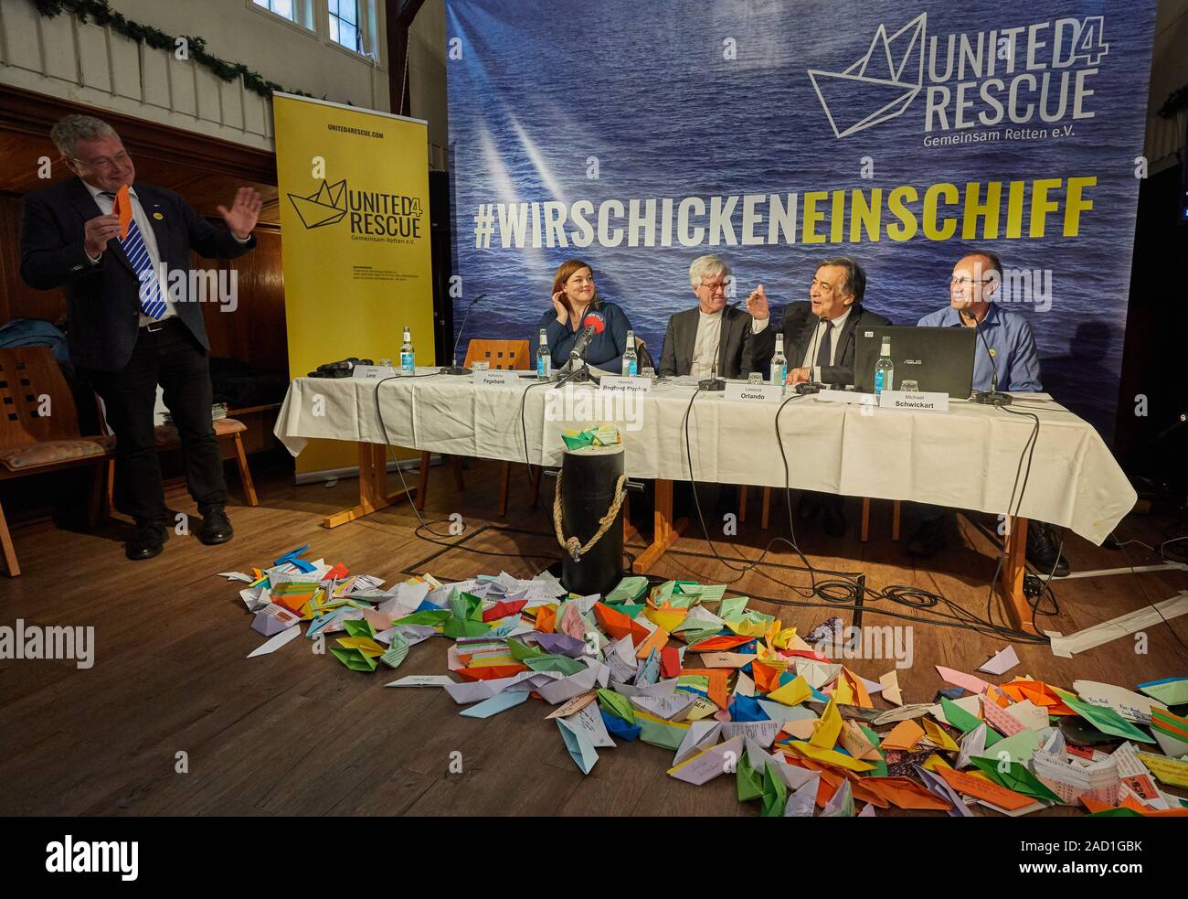 Hamburg, Germany. 03rd Dec, 2019. Joachim Lenz (l-r), Speaker, Katharina Fegebank (Greens), Second Mayor of Hamburg, Heinrich Bedford-Strohm, President of the Council of the Evangelical Church in Germany, Leoluca Orlando, Mayor of Palermo, and Michael Schwickart, Sea-Watch, a sea rescue specialist, will give a press conference on the new alliance 'United4Rescue - Rescuing Together' at the River Ship Church. The civil society alliance of churches, municipalities and associations wants to send another ship to the Mediterranean Sea for rescue at sea. Credit: Georg Wendt/dpa/Alamy Live News Stock Photo
