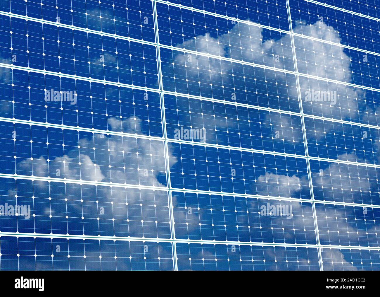 Solar panels. Close-up of clouds and blue sky reflected in the surface ...