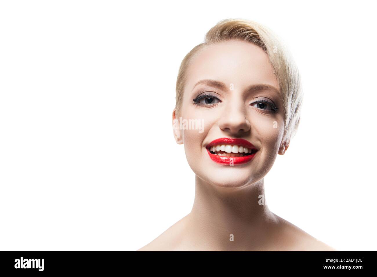 Cheerful blonde-haired model with red lips smiling at camera Stock Photo