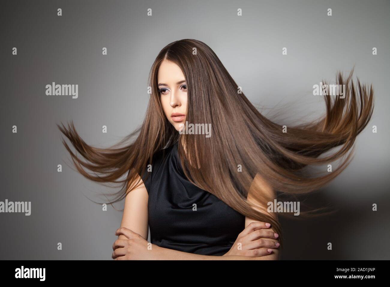 Beautiful model with smooth flying hair Stock Photo