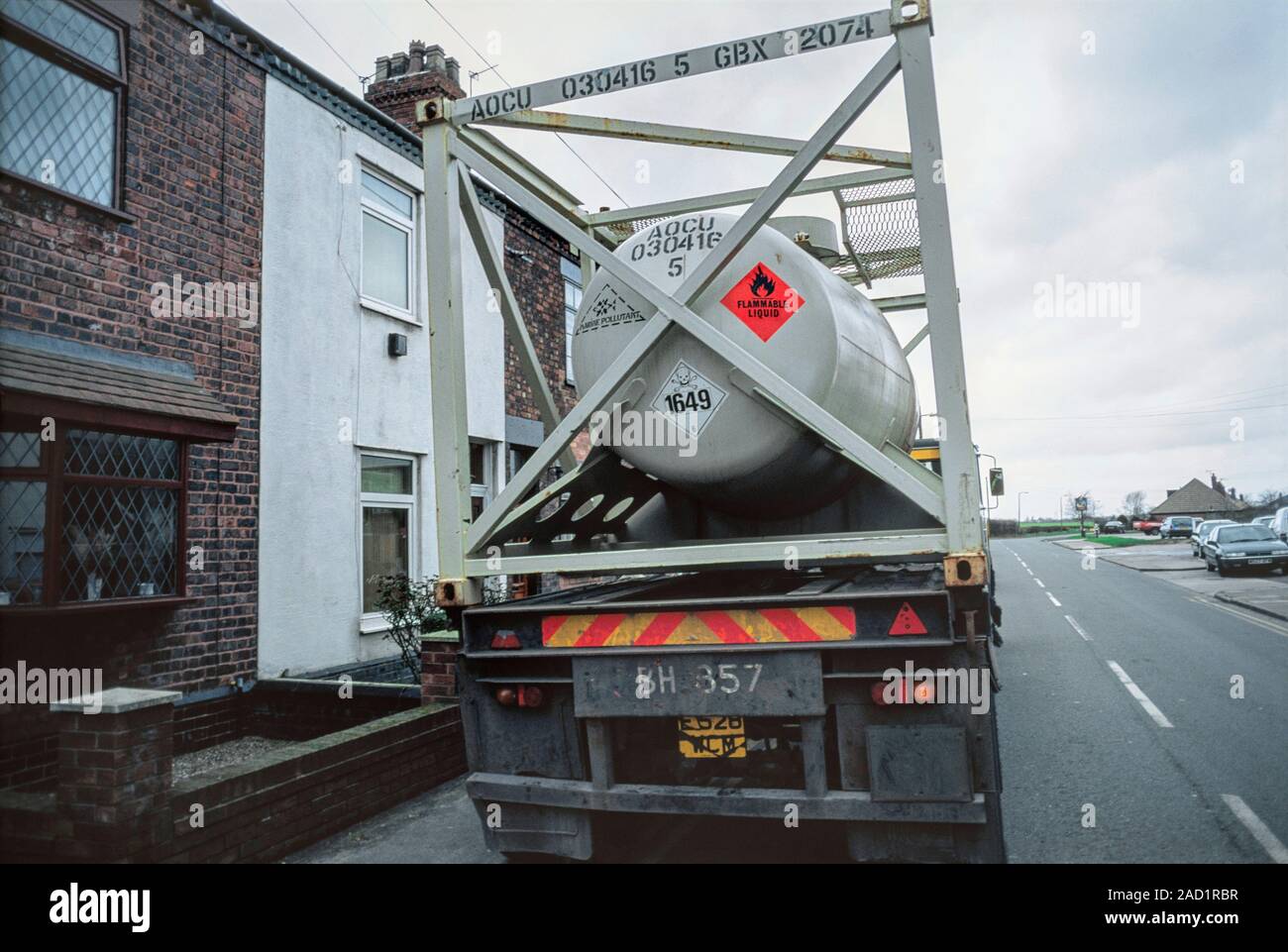 Tanker of motor fuel antiknock mixture parked outside terraced house