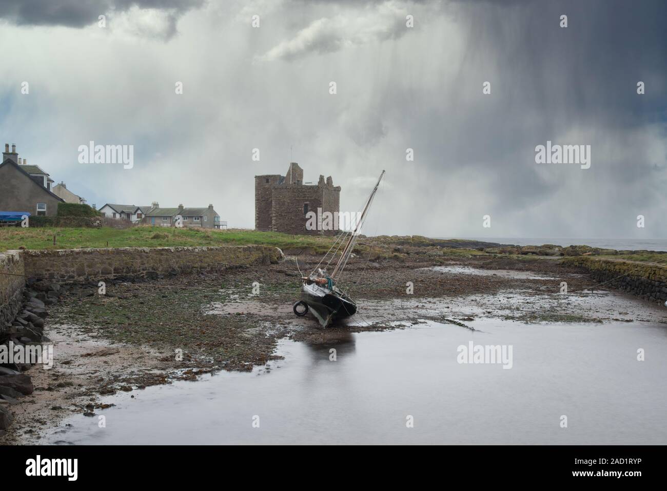 As the heavy rains come in over the ancient ruins that are Portencross in Seamill Scotland Stock Photo