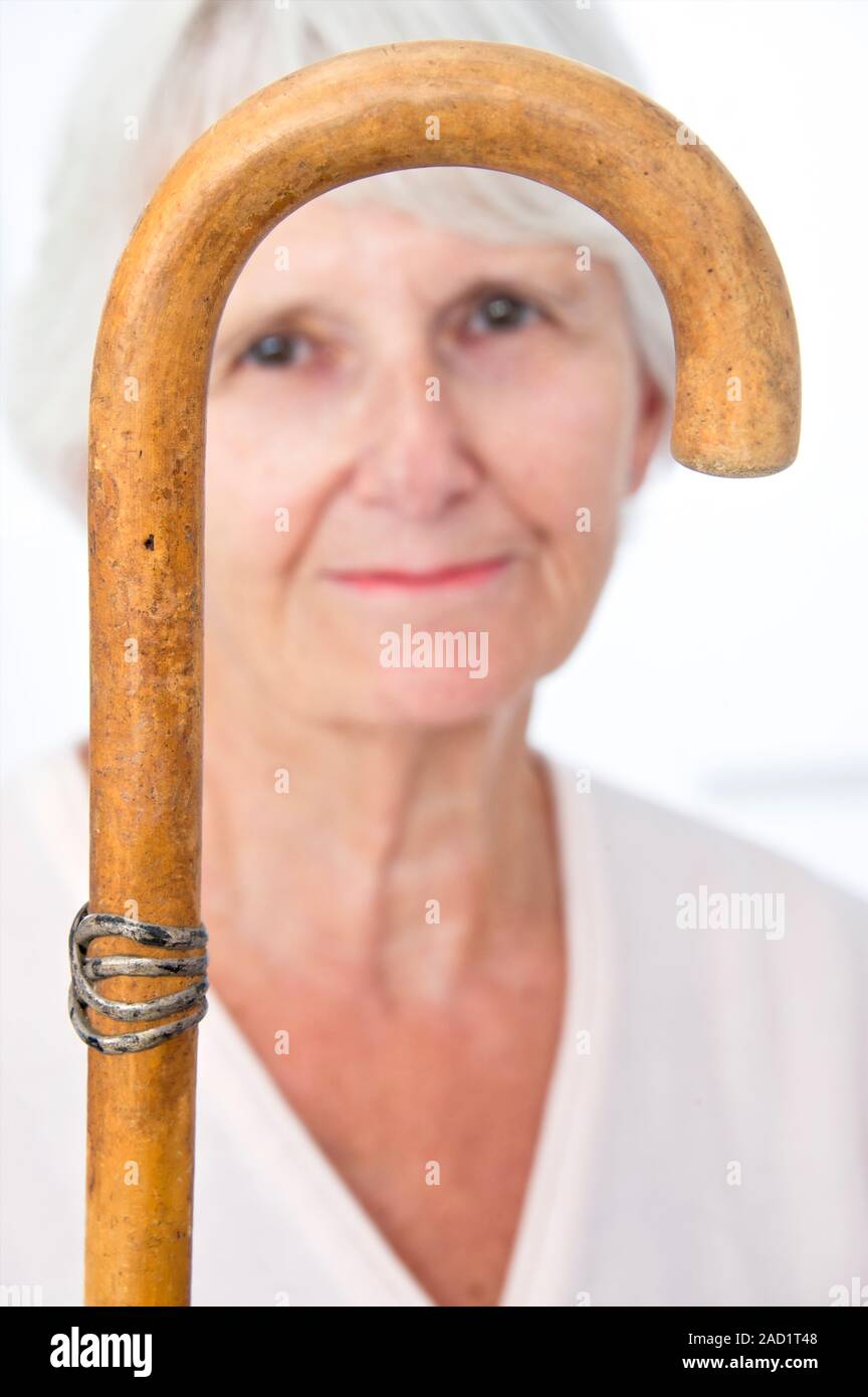 Elderly woman and a walking stick Stock Photo Alamy