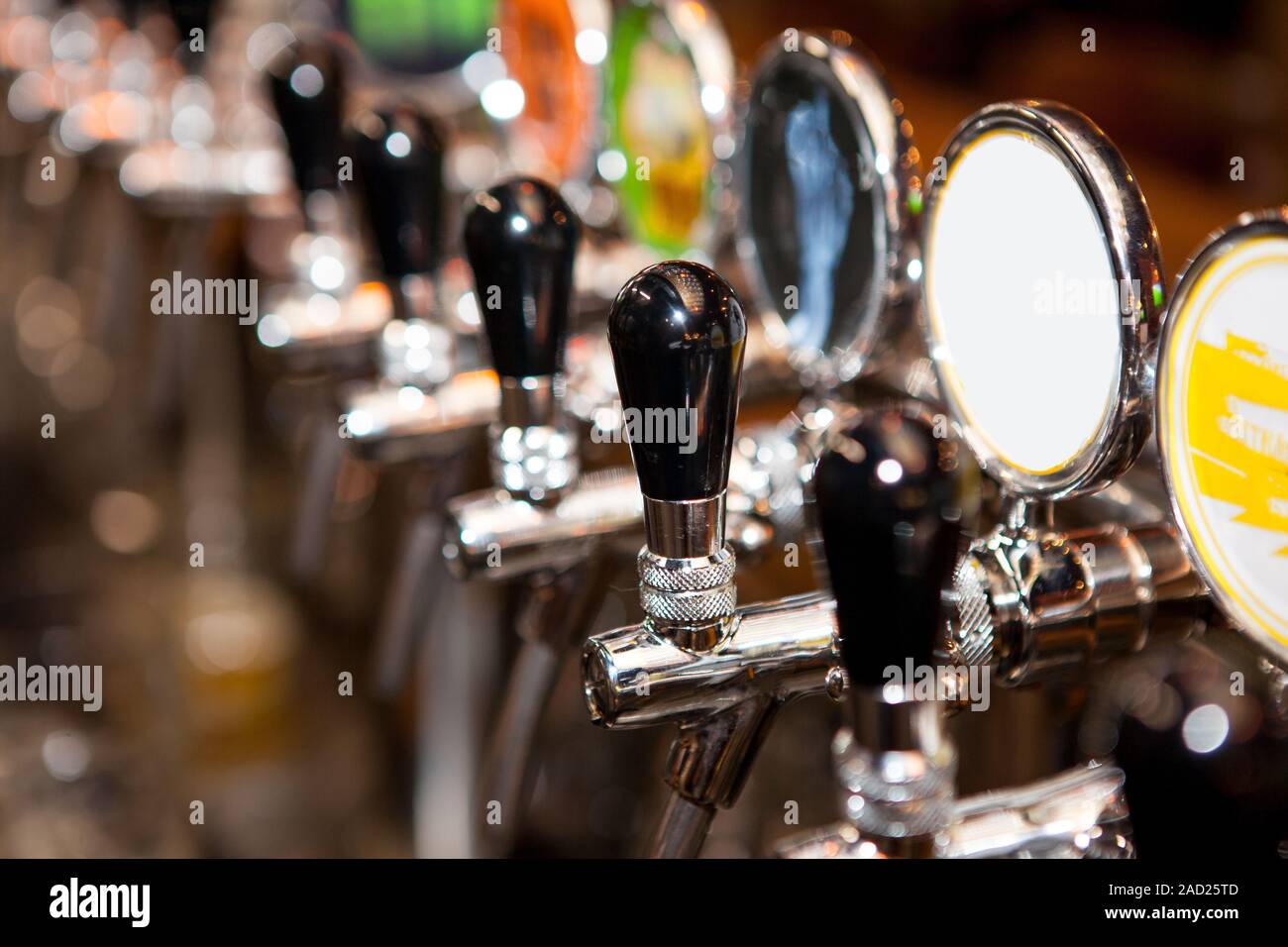 Row of Beer Taps in Bar for different types of drink. Bar interior