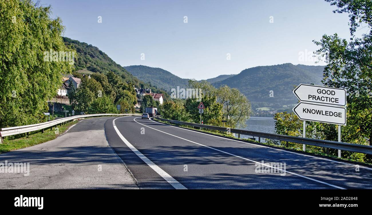 Direction road sign to good practice and skills Stock Photo