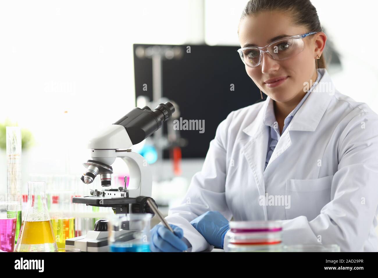 Smiling biomedical researcher in eyewear Stock Photo