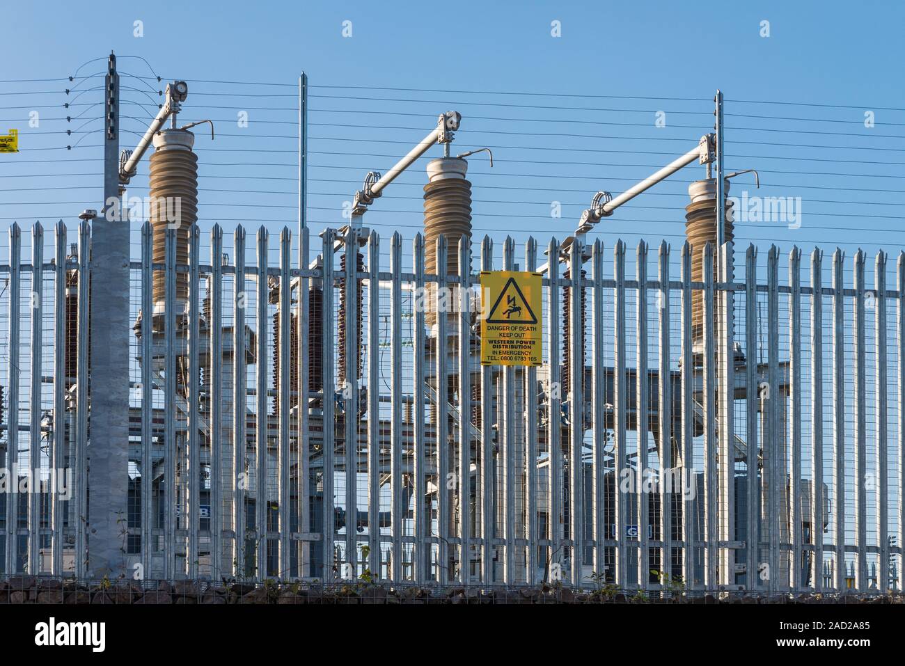 Electricity generator power sub-station with yellow danger of death sign Stock Photo