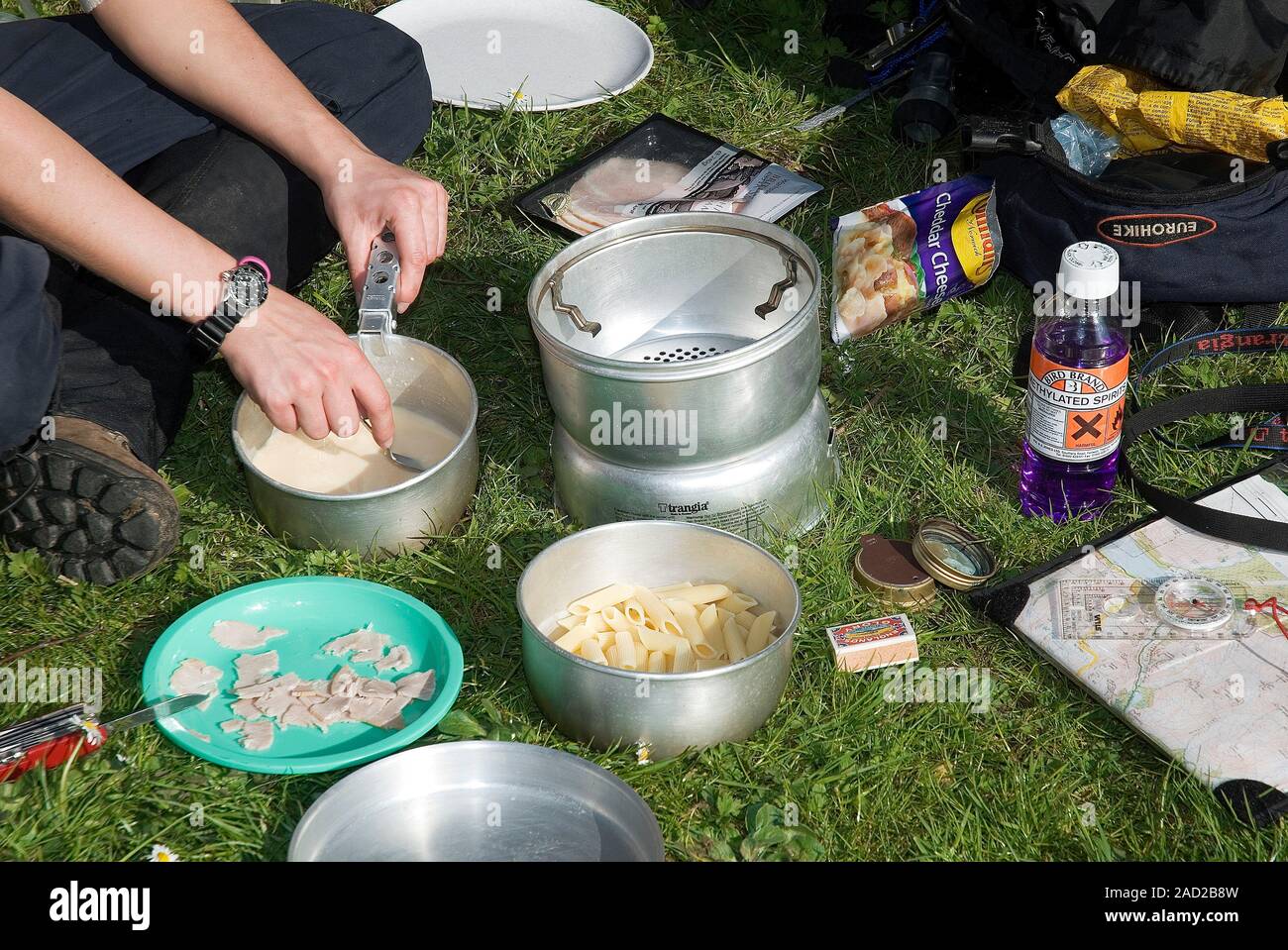 Methylated spirits camping stove. Person on a Duke of Edinburgh