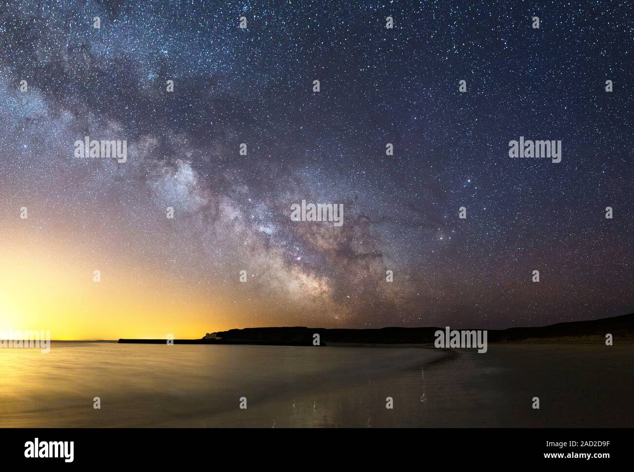 Milky Way over the coast. View of the Milky Way in the night sky over a ...