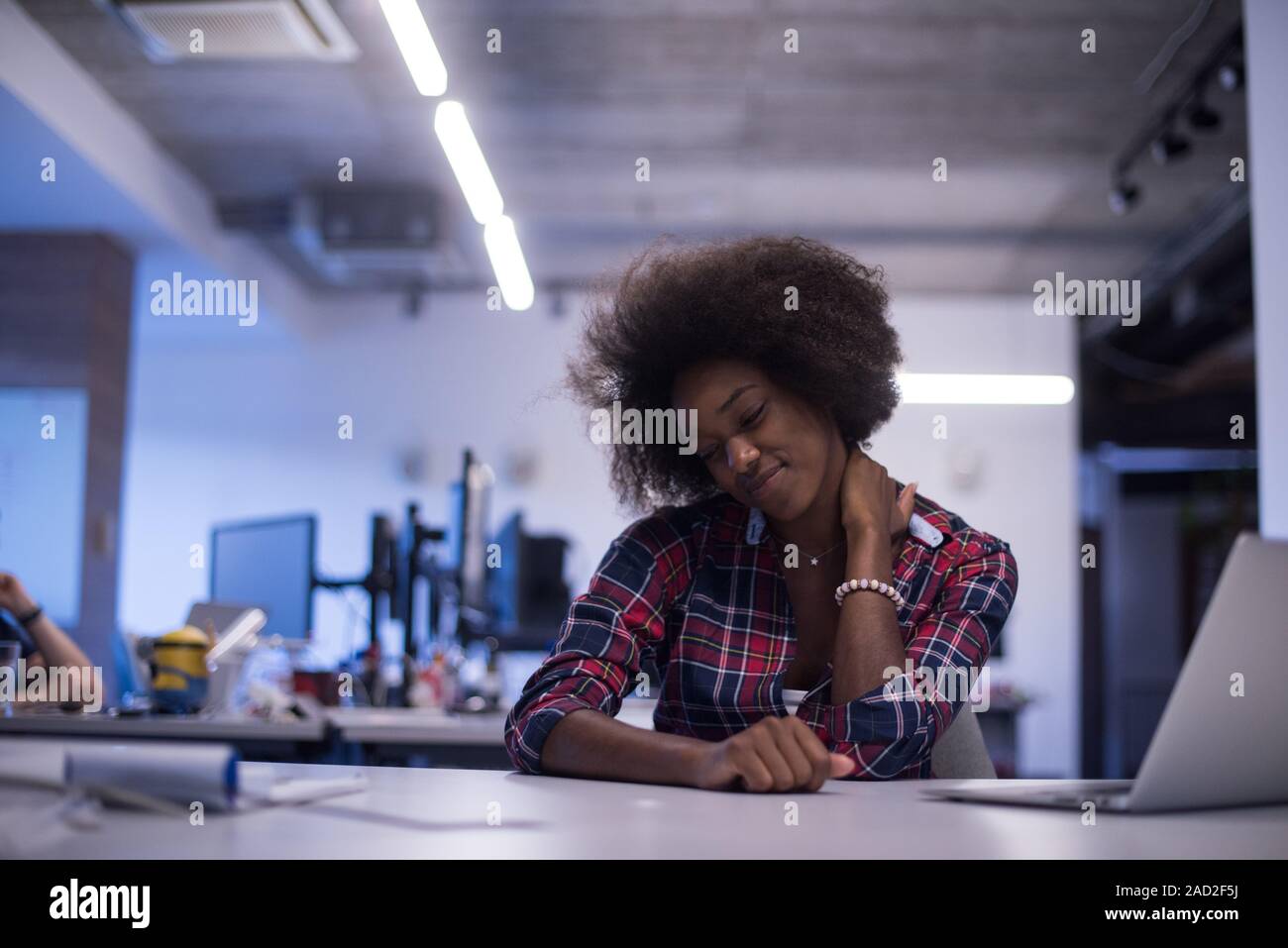 portrait of a young successful African-American woman in modern office ...