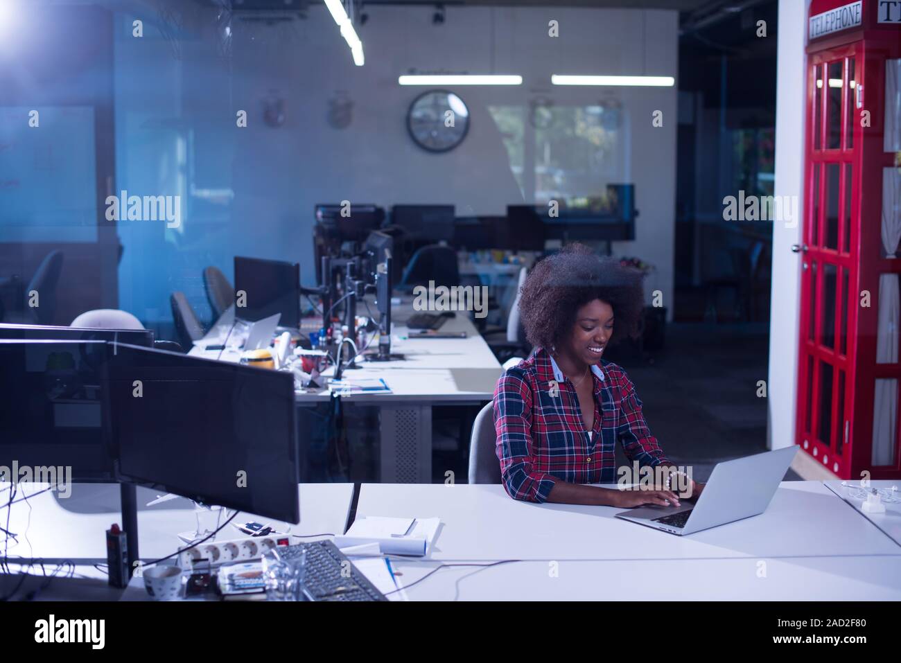portrait of a young successful African-American woman in modern office ...