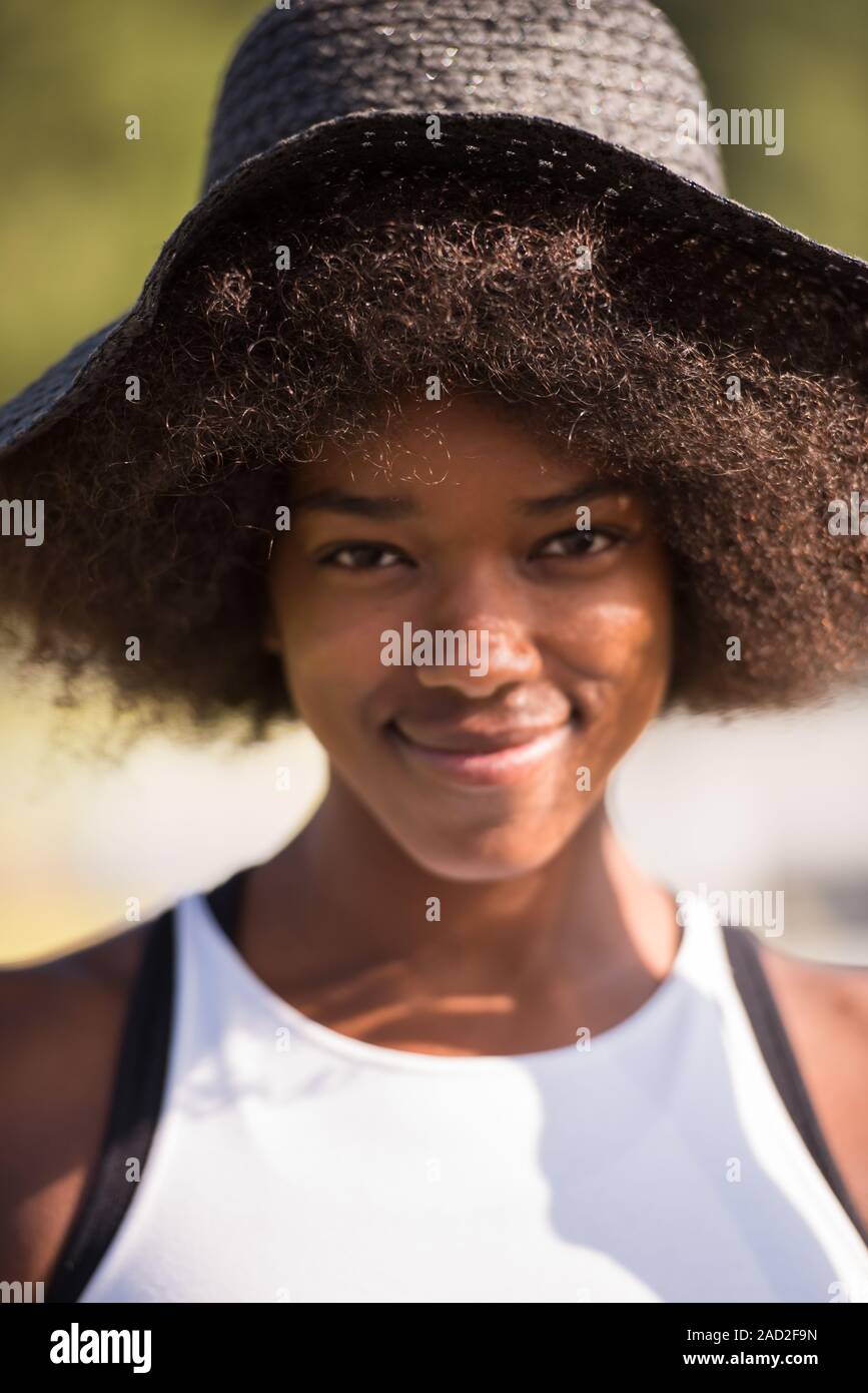 Close up portrait of a beautiful young african american woman smiling ...