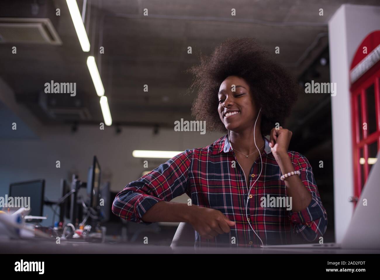 portrait of a young successful African-American woman in modern office ...
