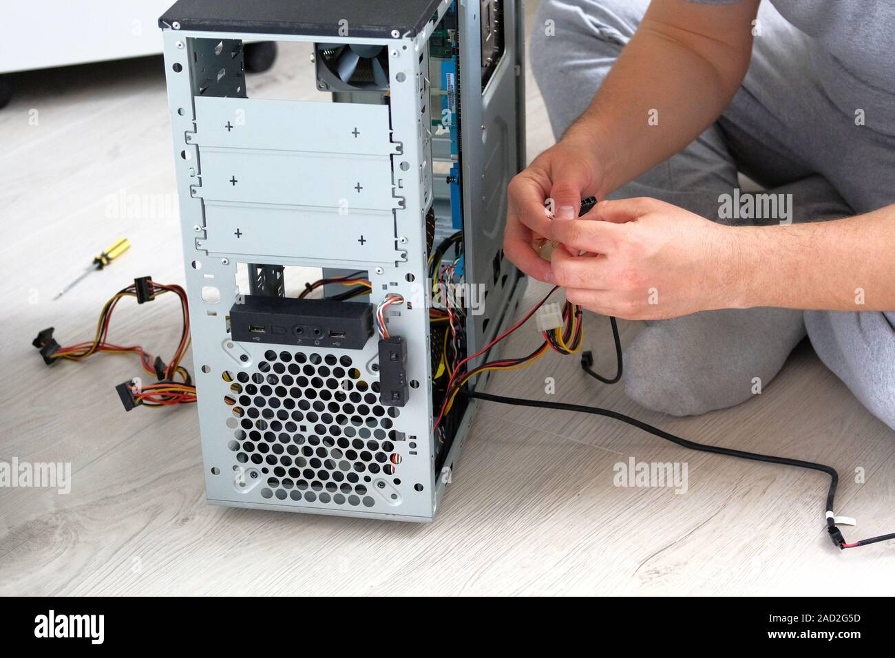 Service electronics and computers concept. Computer engineer is repairing PC. Computer repair. Stock Photo