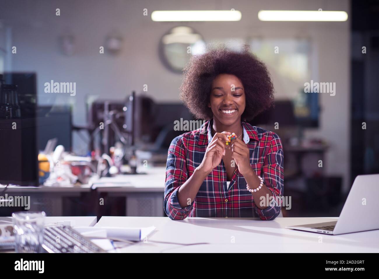 portrait of a young successful African-American woman in modern office ...