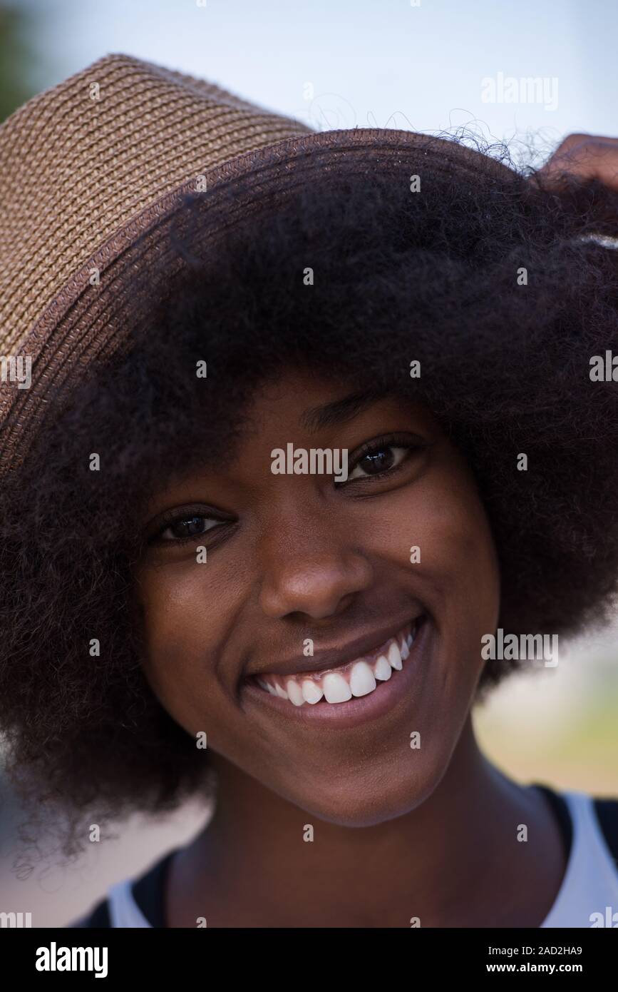 Close up portrait of a beautiful young african american woman smiling ...