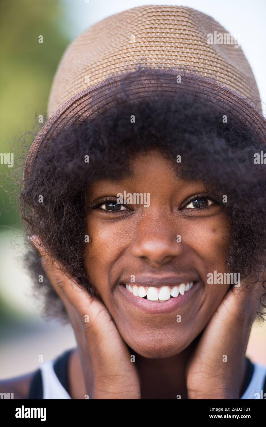 Close up portrait of a beautiful young african american woman smiling ...