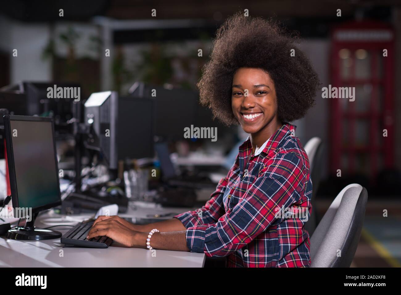portrait of a young African American woman in modern office Stock Photo ...