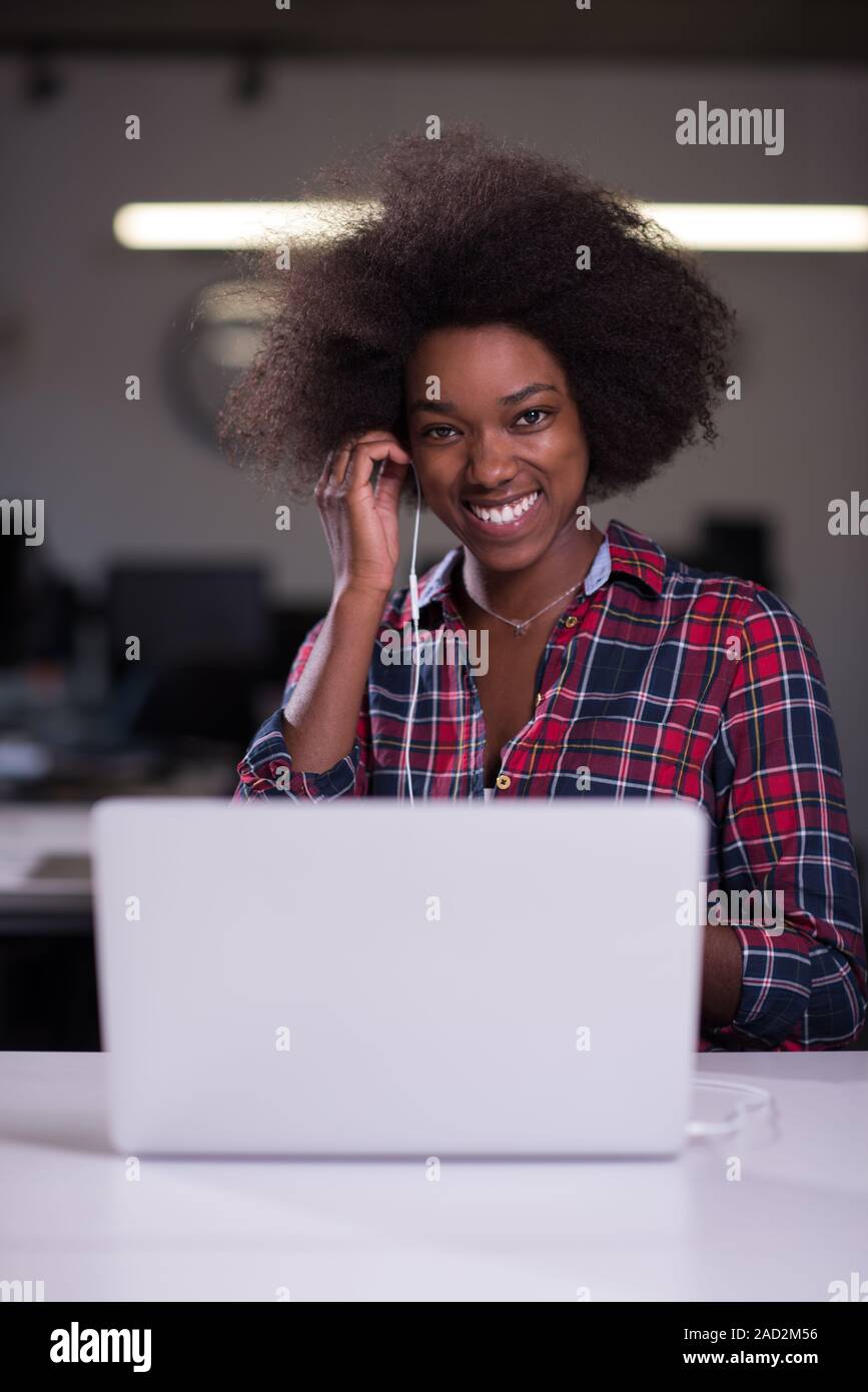 portrait of a young successful African-American woman in modern office ...