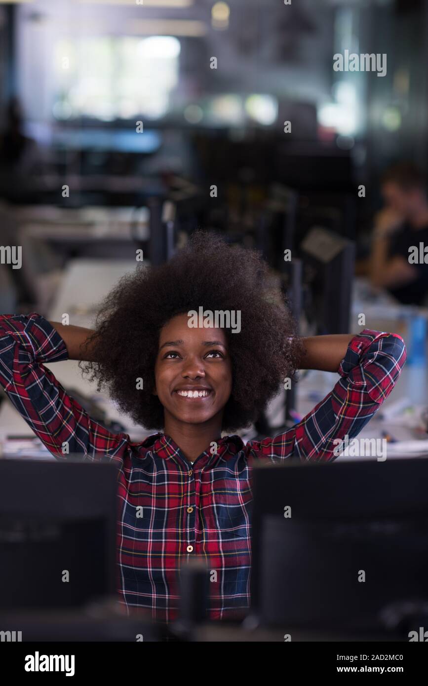 portrait of a young successful African-American woman in modern office ...