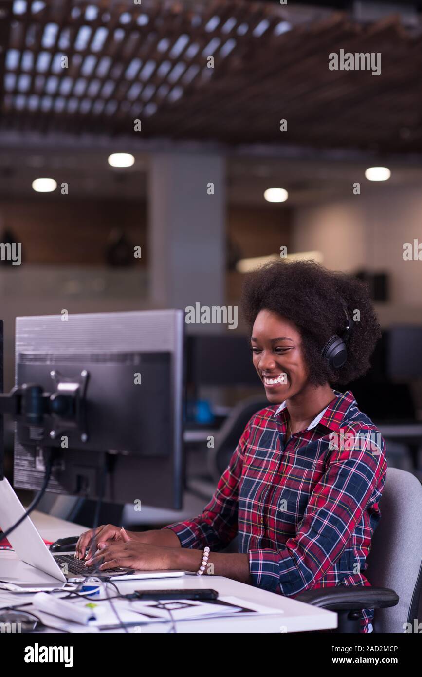 portrait of a young successful African-American woman in modern office ...