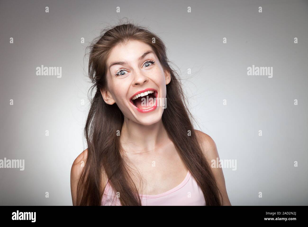 Crazy girl screaming loud. Stock Photo