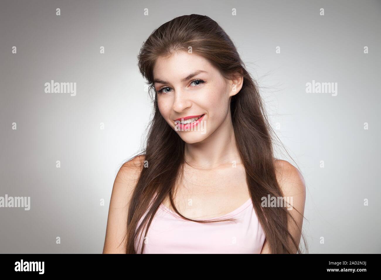 Portrait of smiling girl posing at camera Stock Photo - Alamy
